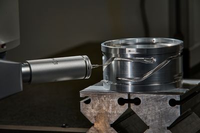 Metal mill being cut into with precision CNC machinery